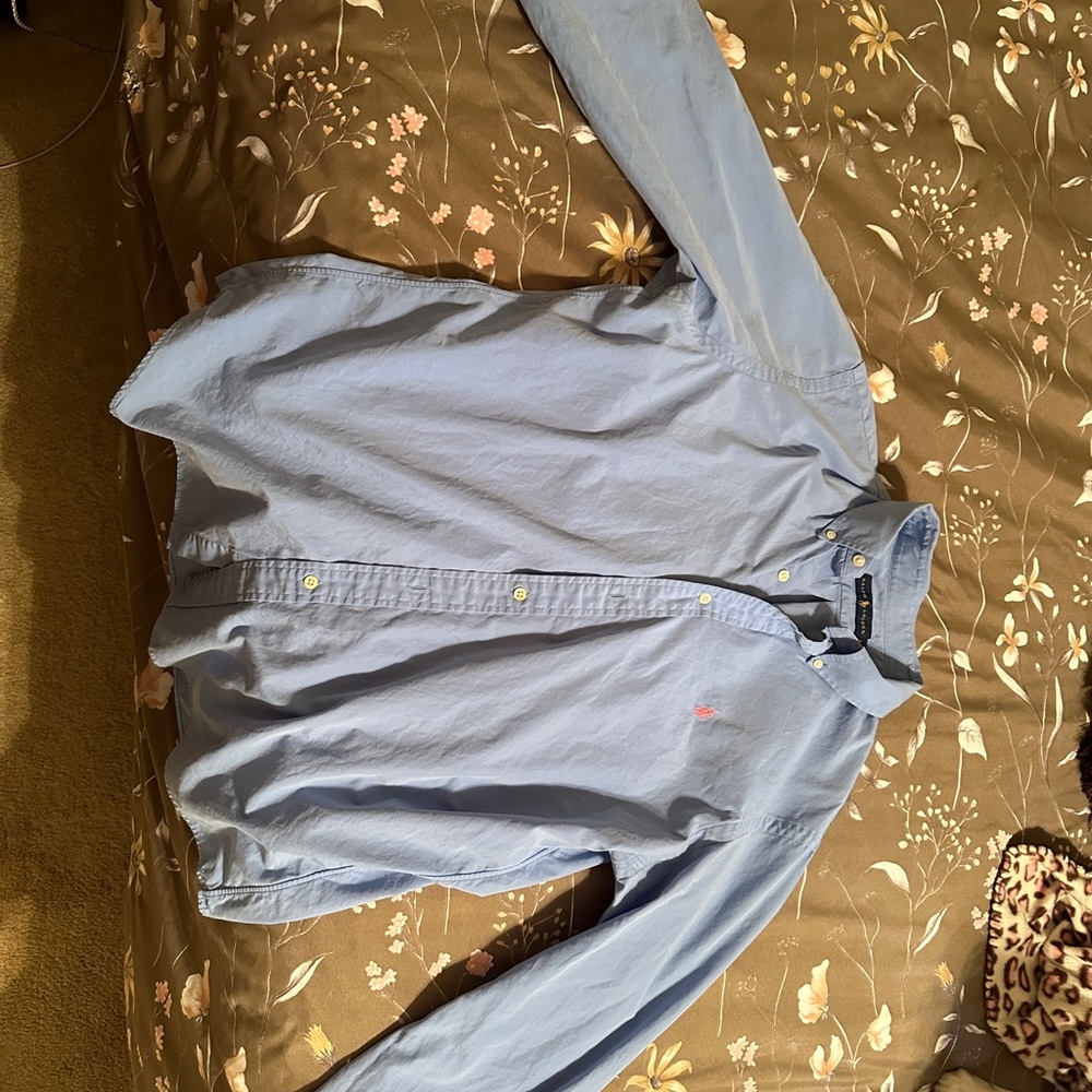 Light blue long sleeve polo dress shirt. Comes from a non smoking home.